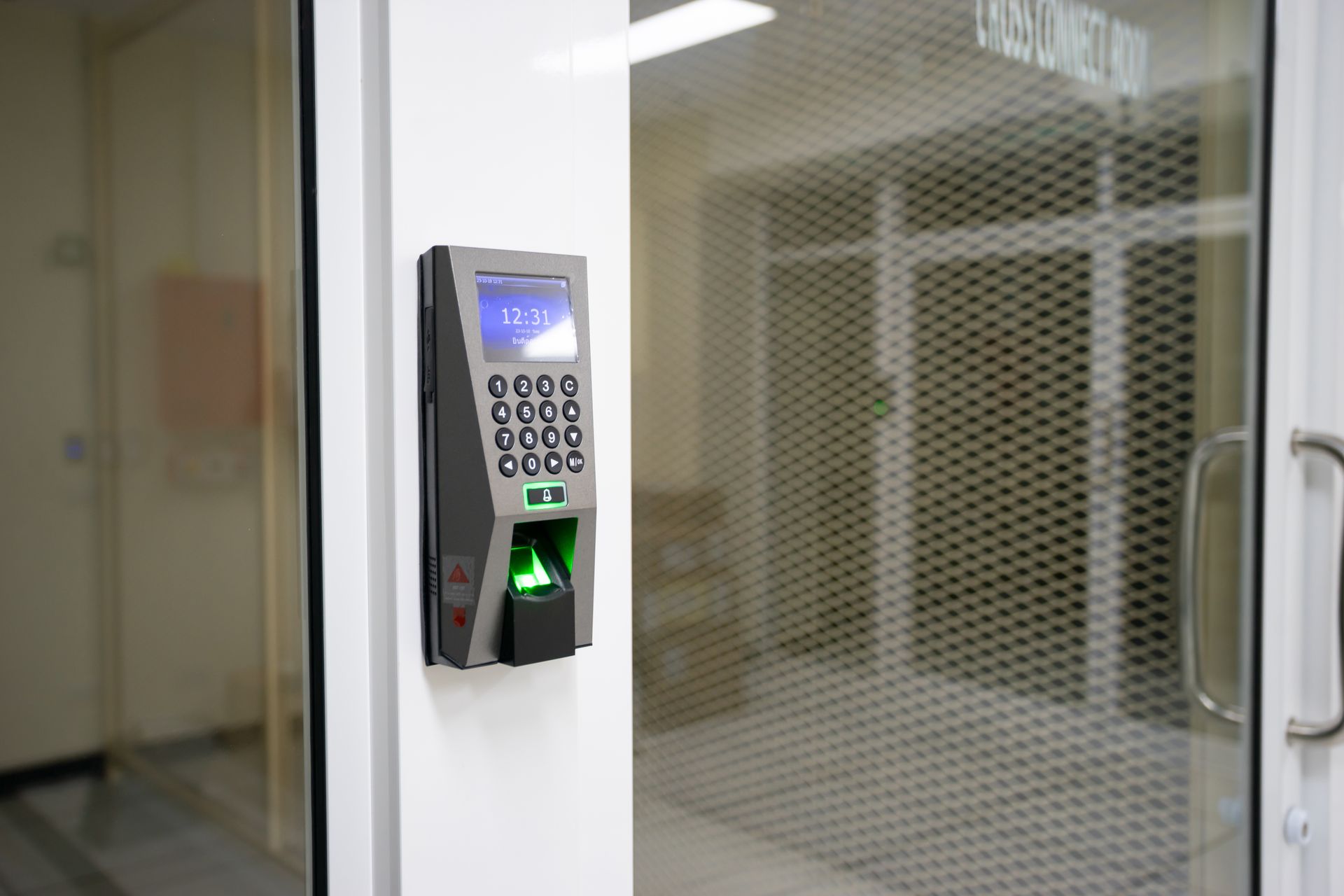 Fingerprint access control reader mounted on a wall